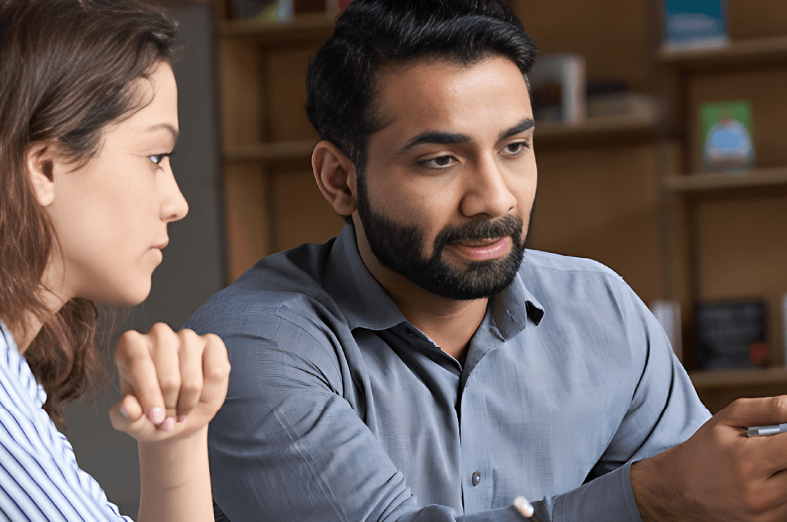 2 employee discussing employment background checks